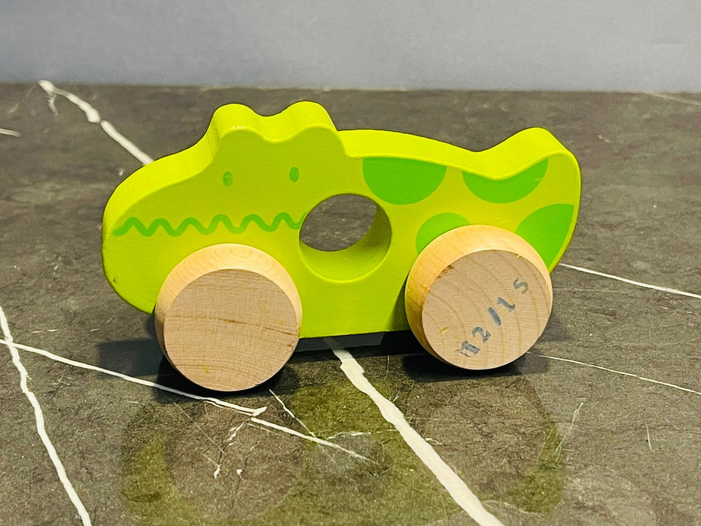 Wooden pull-along toy - crocodile.