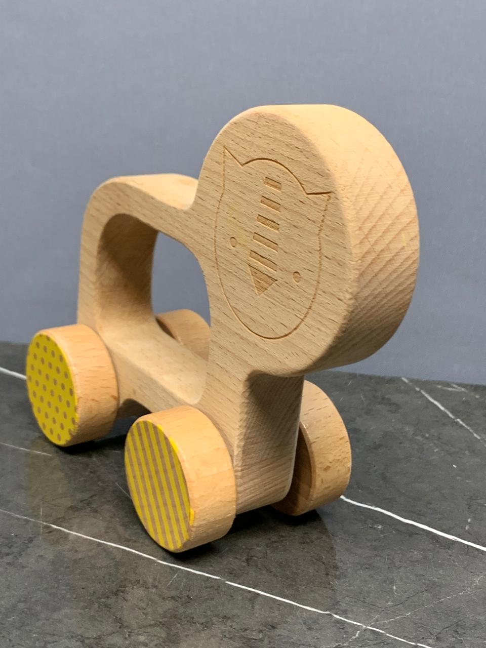 Petit Collage Lion Wooden Push Toy.