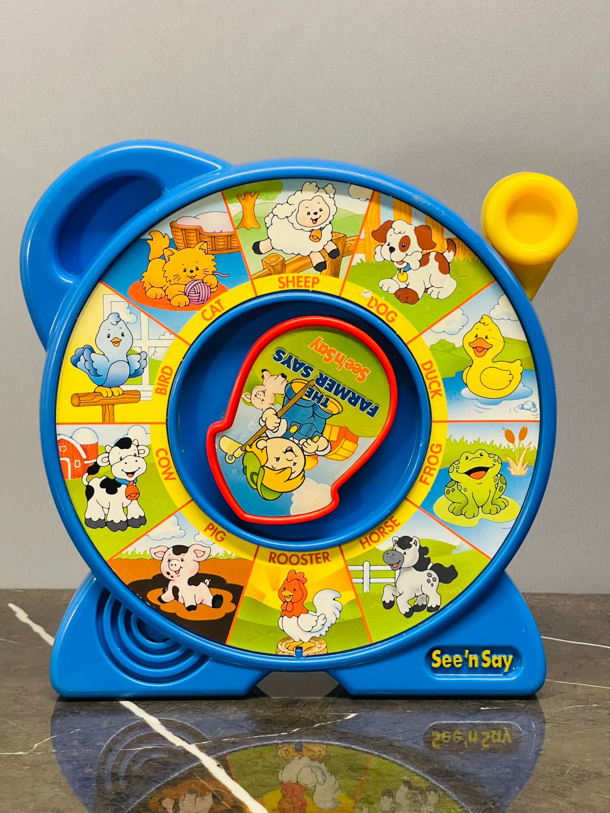 Fisher-Price See 'n Say "The Farmer Says" toy.