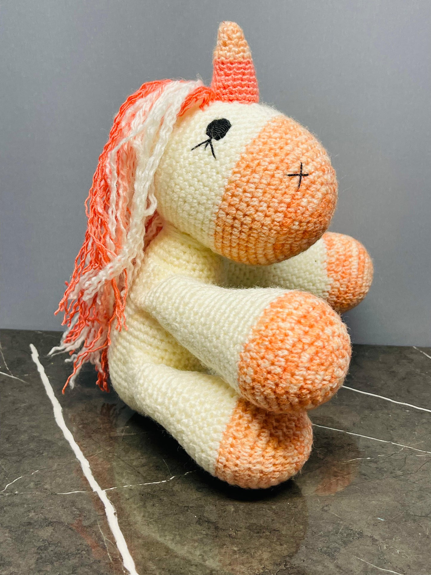 Crocheted Unicorn Plush Toy.