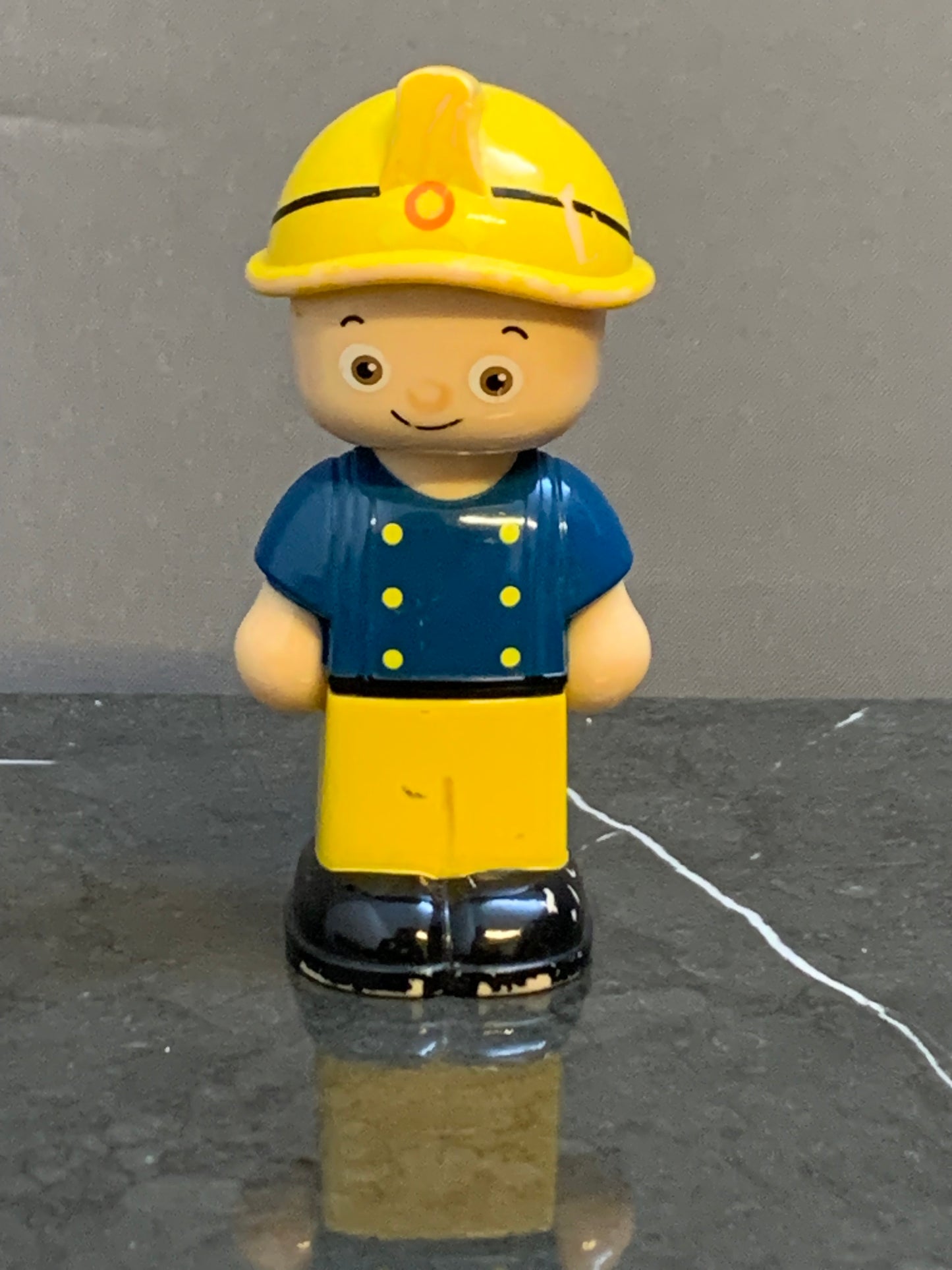 Construction worker figurine