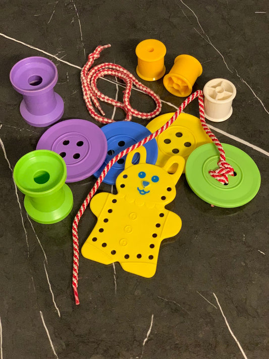 A Lacing Toy and Spool Set.