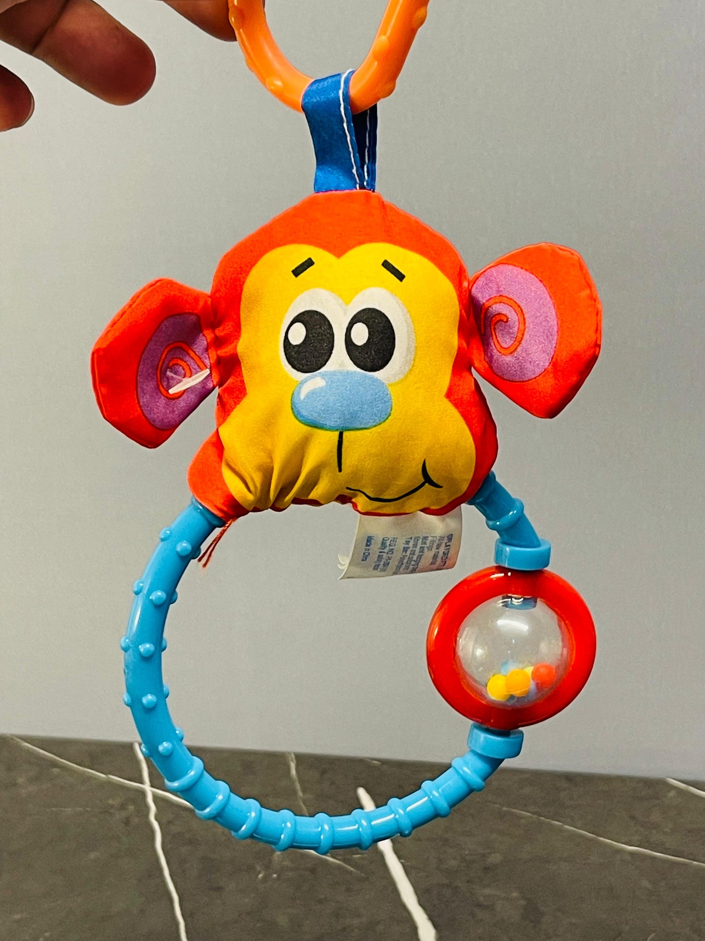 Playgro Dingly Dangly Curly the Monkey.