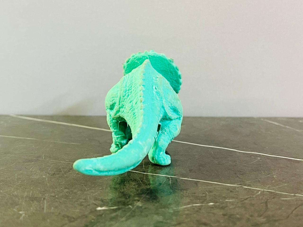 Triceratops Dinosaur Figurine. (foot broken)