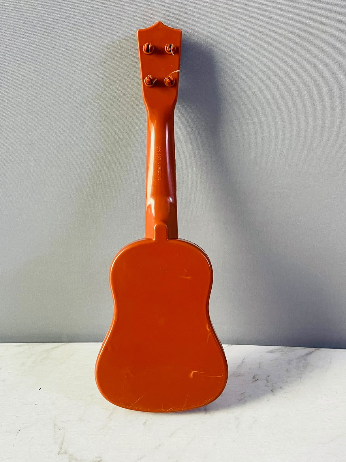 The Teissuly Kids Toy Guitar Ukulele (Rs 300)