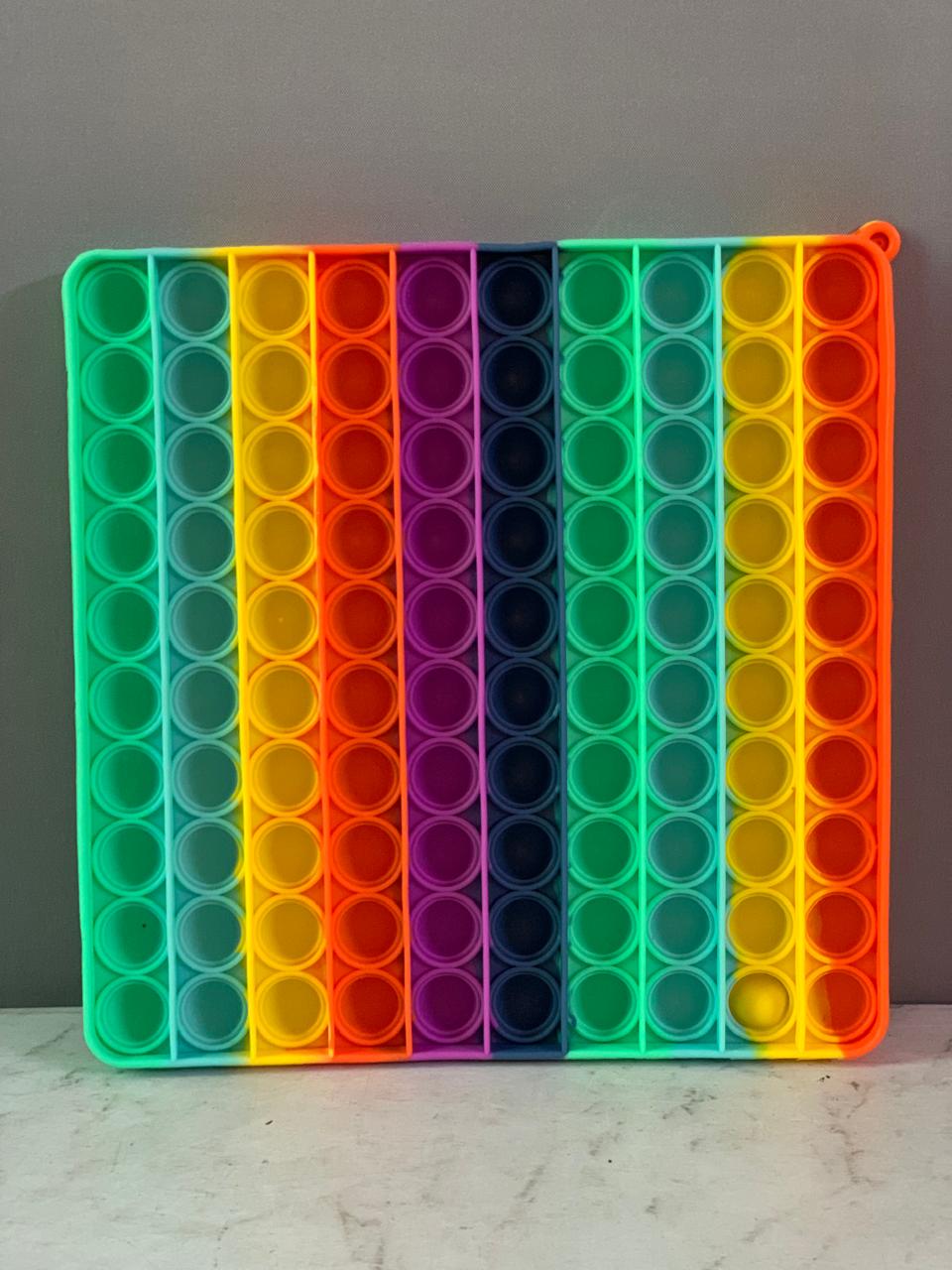 Rainbow Square Dimples Fidget Toy. (Rs 200 advance)