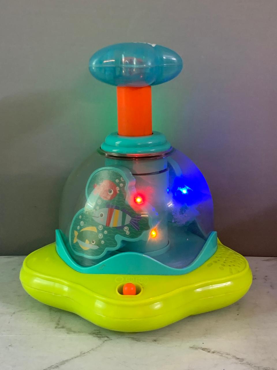Bright Starts Press and Glow Spinner Cause and Effect Musical Baby Toy.(batteries cover missing)(Rs 250 advance)