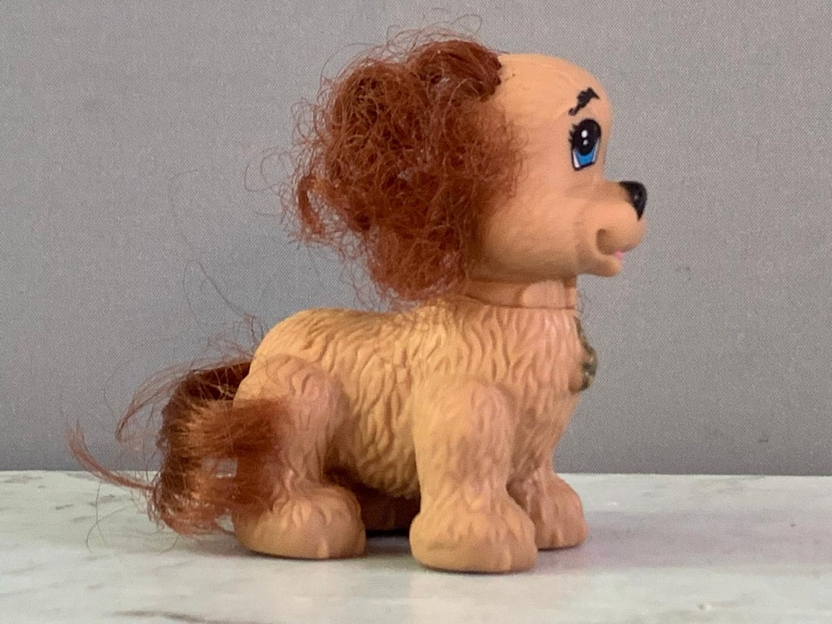 Fisher-Price Snap 'N Style Pets Coco the Cocker Toy Figure.