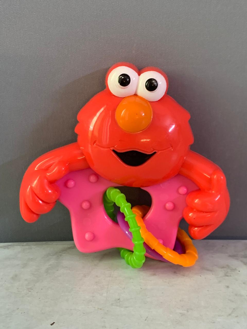 Sesame Street Elmo Rattle with Rings. (Rs 100 advance)