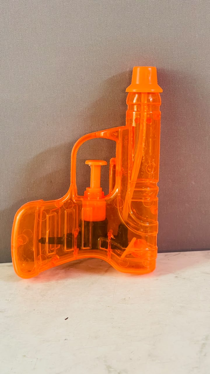 Transparent Plastic Mini Water Pistol. (Rs 100 advance)