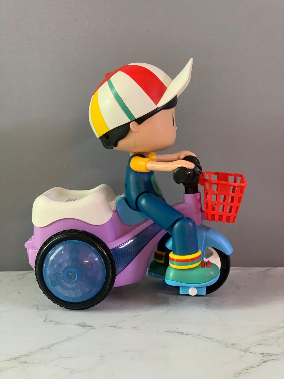 Popsugar Musical Bump and Go Stunt Tricycle. (Foot detached, must check video)(Rs 350 advance)