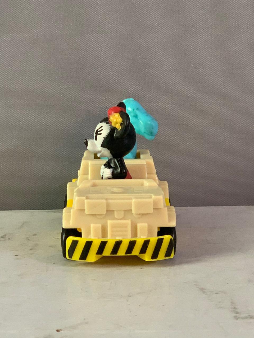 Minnie Mouse in a dinosaur ride vehicle