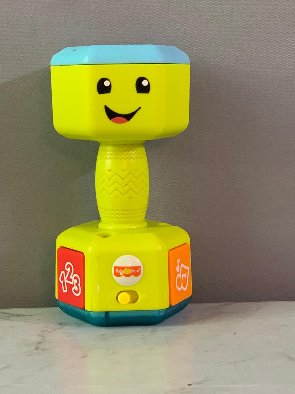 Fisher-Price Laugh & Learn Countin' Reps Dumbbell.(Batteries need replacement)(Rs 200 advance)