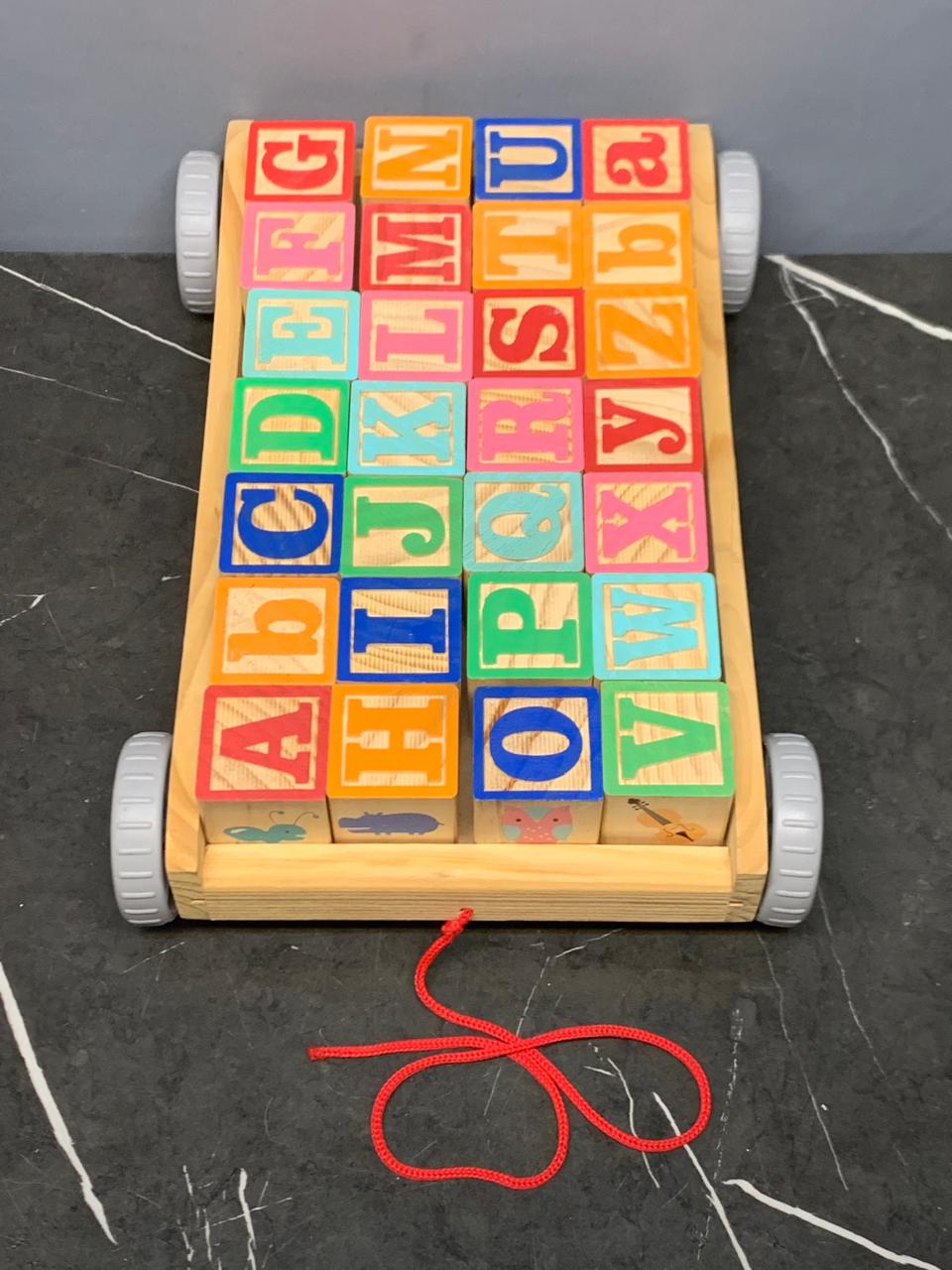 Wooden Pull Along ABC Blocks Cart. (Rs 450 advance) SKU:BXL-005