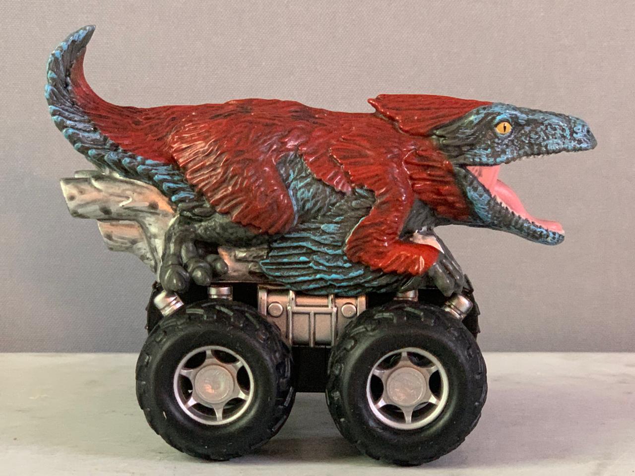 Jurassic World Zoom Riders Pyroraptor Pullback Vehicle.