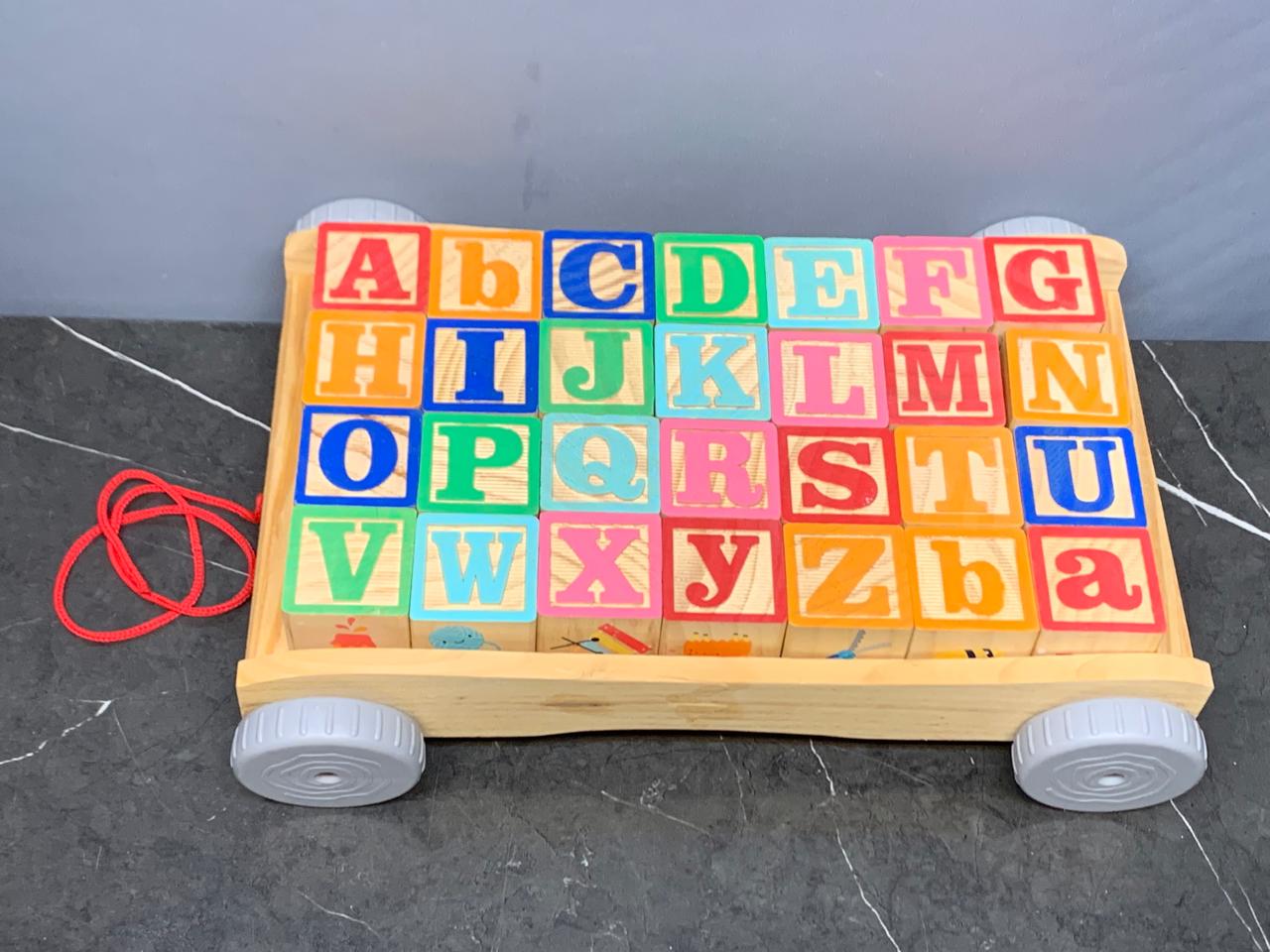 Wooden Pull Along ABC Blocks Cart. (Rs 450 advance) SKU:BXL-005