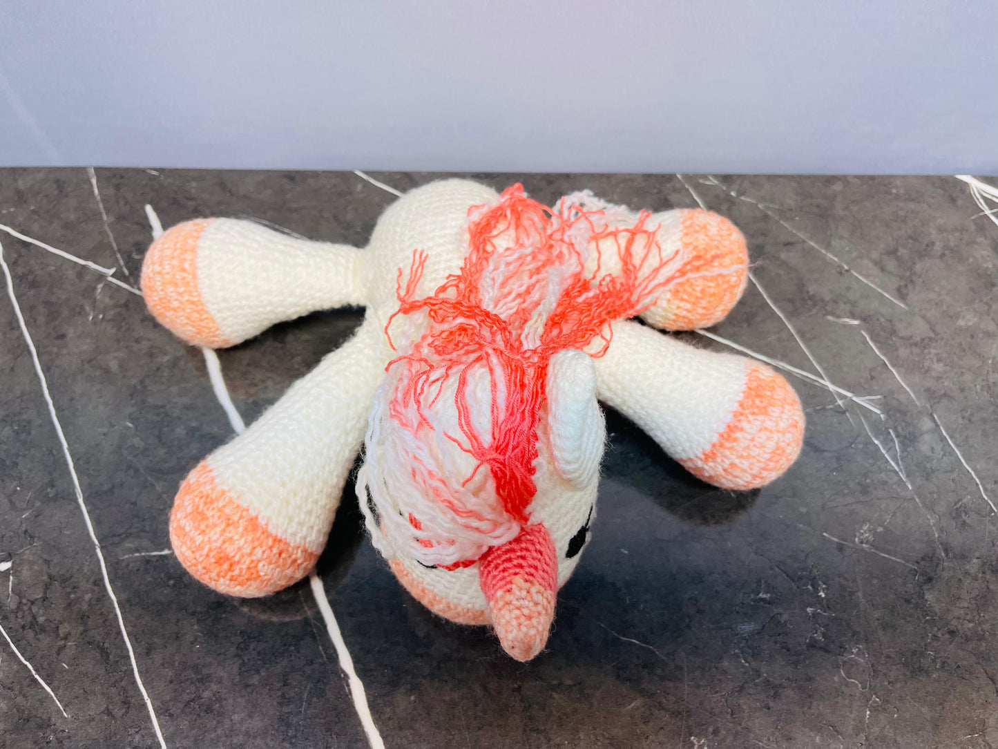 Crocheted Unicorn Plush Toy.