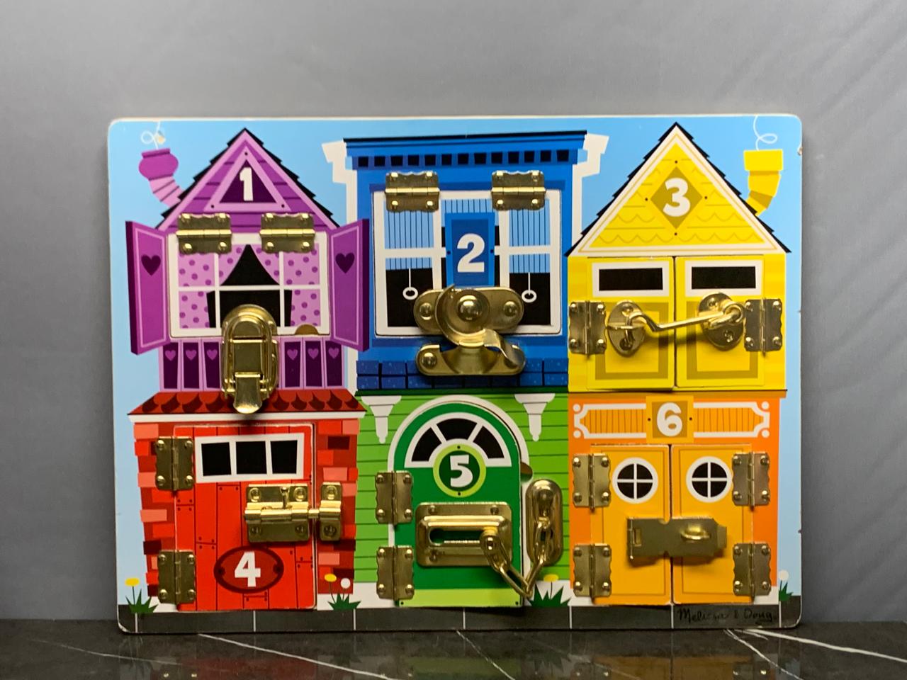 Melissa & Doug Latches Wooden Activity Board. (Rs 300 advance) SKU:BXL-007