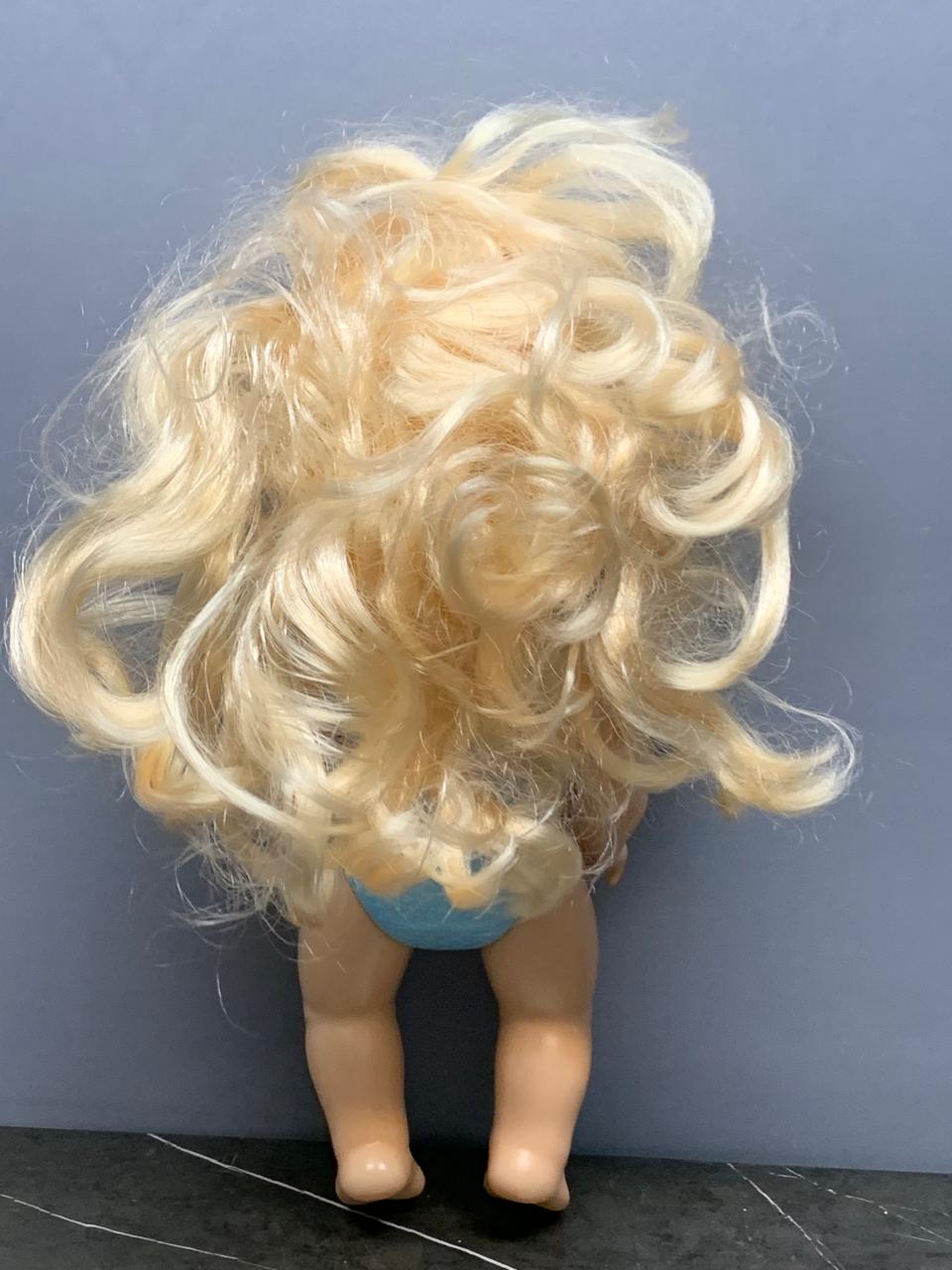 Blonde-Haired Baby Doll in Blue Swimsuit